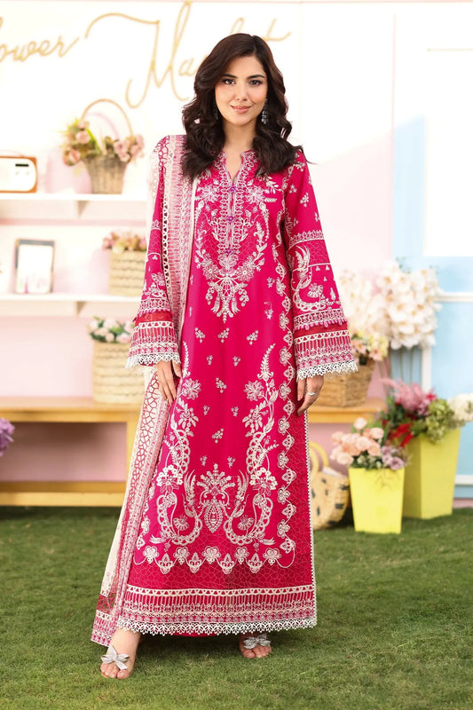 A woman wearing a hot pink lawn suit with embroidered details and a chiffon dupatta.
